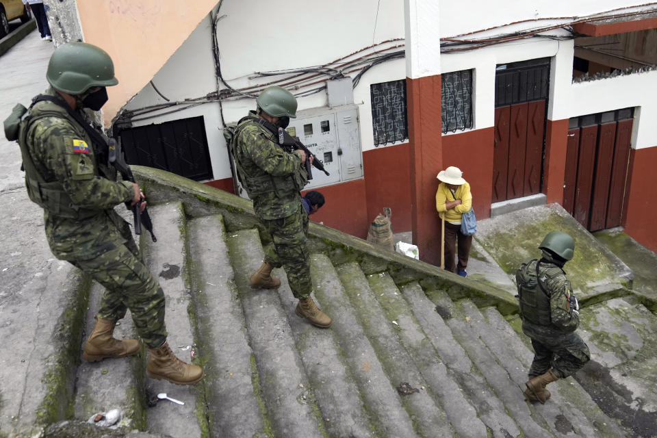 Soldiers patrol a residential area on the south side of Quito, Ecuador, Friday, Jan. 12, 2024, in the wake of the apparent escape of a powerful gang leader from prison. President Daniel Noboa decreed Monday a national state of emergency, a measure that lets authorities suspend people’s rights and mobilize the military. (AP Photo/Dolores Ochoa)