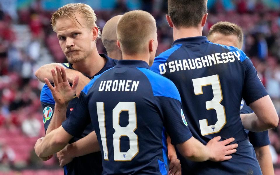 Finland's Joel Pohjanpalo, left, celebrates after scoring his side's opening goal during the Euro 2020 soccer championship group B match between Denmark and Finland  - AP