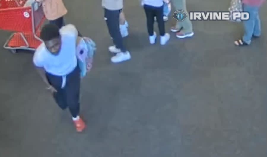 The suspects are seen running through a line of customers with stolen merchandise. (Irvine Police Deaprtment)