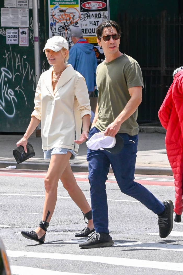 the couple crossing the street