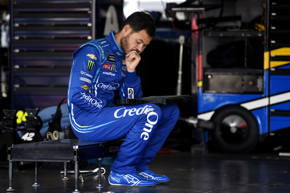 Kyle Larson waits in the garage area as his team preps his back up car after Larson crashed during a practice session for Sunday's NASCAR Cup Series auto race, Saturday, July 27, 2019, in Long Pond, Pa. (AP Photo/Derik Hamilton)