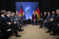 President Donald Trump meets with German Chancellor Angela Merkel during the NATO summit at The Grove, Wednesday, Dec. 4, 2019, in Watford, England. President Donald Trump is calling Canadian Prime Minister Justin Trudeau “two-faced” after he was overheard appearing to gossip about Trump. (AP Photo/ Evan Vucci)