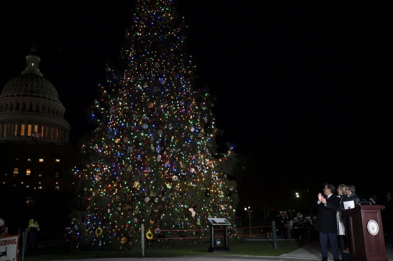 The 2023 Capitol Christmas Tree, a 63-foot Norway spruce from the Monongahela National Forest in West Virginia, is illuminated during a lighting ceremony on the West Front Lawn of the U.S. Capitol in Washington, D.C., on Tuesday. The Monongahela forest was the first national forest to provide a tree on behalf of the Forest Service in 1970. Photo by Bonnie Cash/UPI.