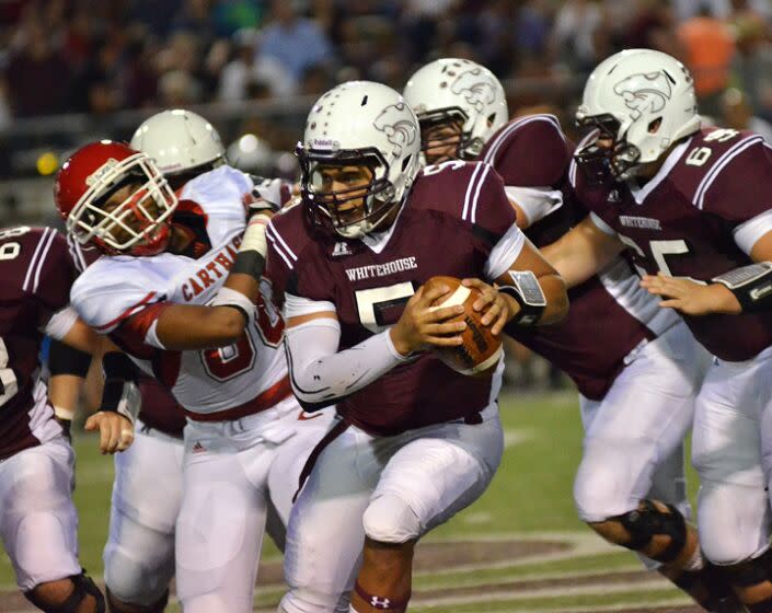 In this Sept. 27, 2013 photo, Whitehouse High School quarterback Patrick Mahomes scrambles.