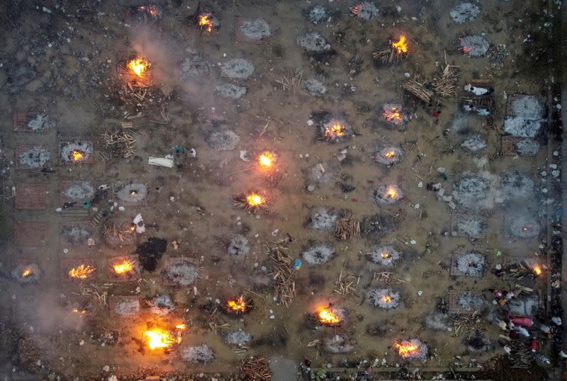 A mass cremation of victims who died due to the coronavirus disease (COVID-19), is seen at a crematorium ground in New Delhi