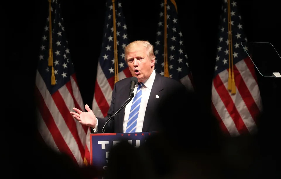 Donald Trump, surrounded by American flags, speaks at an election rally on Sept. 28, 2016, in Council Bluffs, Iowa.