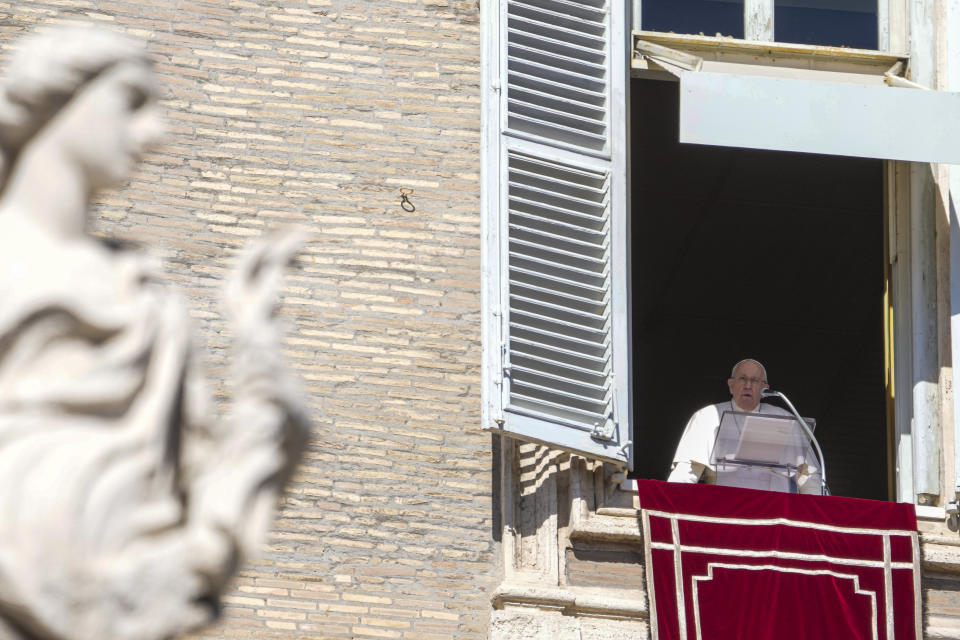 Pope Francis appears at the window of his studio overlooking St. Peter's Square at The Vatican for the traditional Sunday noon blessing of faithful and pilgrims gathered in the Square for the Angelus prayer, Sunday, Feb. 25, 2024. Pope Francis had canceled an audience scheduled for Saturday as a precaution after coming down with mild flu, the Vatican press office said in a short statement, without adding further details. (AP Photo/Gregorio Borgia)