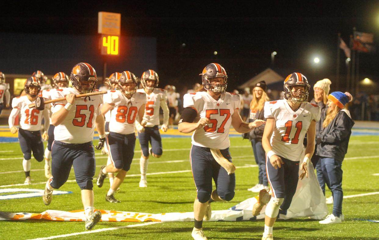 Galion bursts through a banner ahead of its first round playoff matchup against Clyde.
