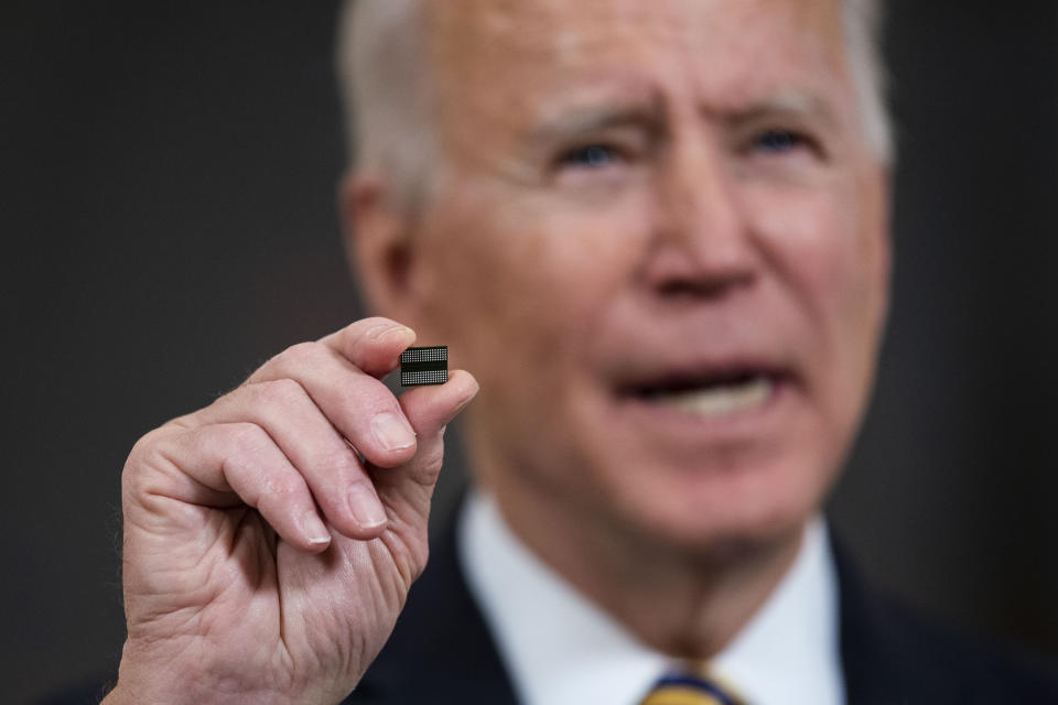 WASHINGTON, DC - FEBRUARY 24: U.S. President Joe Biden holds a semiconductor during his remarks before signing an Executive Order on the economy in the State Dining Room of the White House on February 24, 2021 in Washington, DC.  (Photo by Doug Mills/Pool/Getty Images)