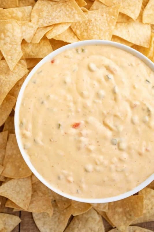 <p>Dinner Then Dessert</p><p>An all-natural creamy chili cheese dip with tomatillo salsa.</p><p><strong>Get the recipe:</strong><a href="https://dinnerthendessert.com/chipotle-queso/" rel="nofollow noopener" target="_blank" data-ylk="slk:Chipotle Queso (Copycat);elm:context_link;itc:0;sec:content-canvas" class="link rapid-noclick-resp">Chipotle Queso (Copycat)</a></p>