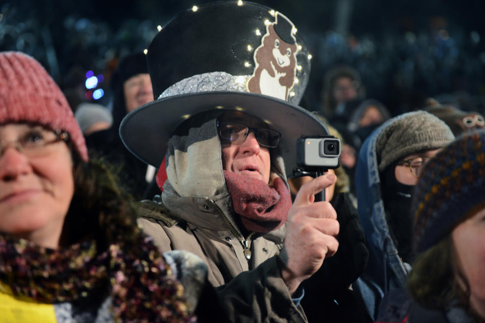 Kevin Smith of Carrollton, Texas, records the pre-dawn celebration while wearing a custom-made oversized hat at the 133rd Groundhog Day in Punxsutawney, Pa. Feb. 2, 2019. (Photo: Alan Freed/Reuters)