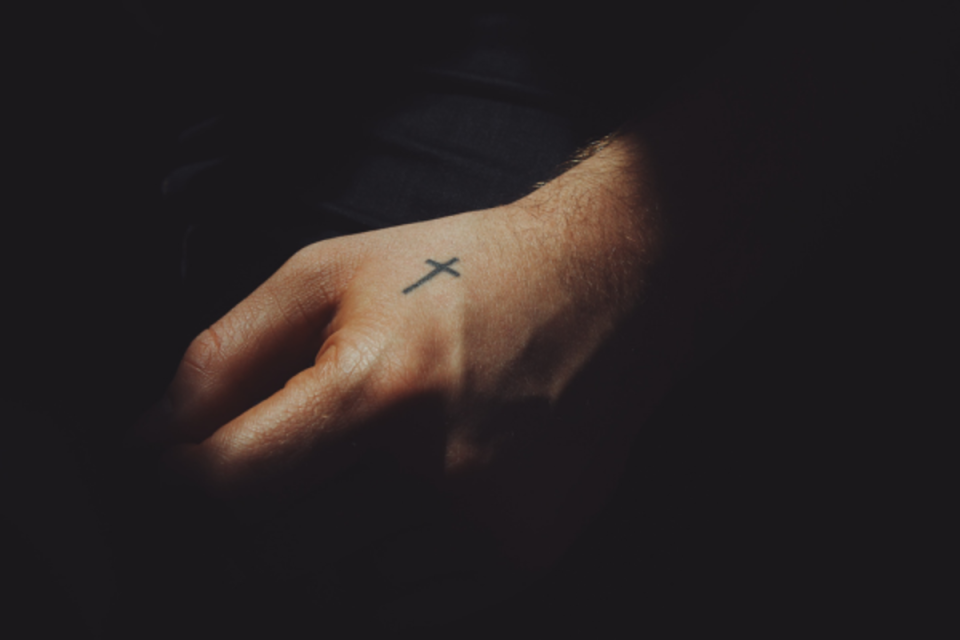 Simple hand cross tattoo <p>Unsplash</p>