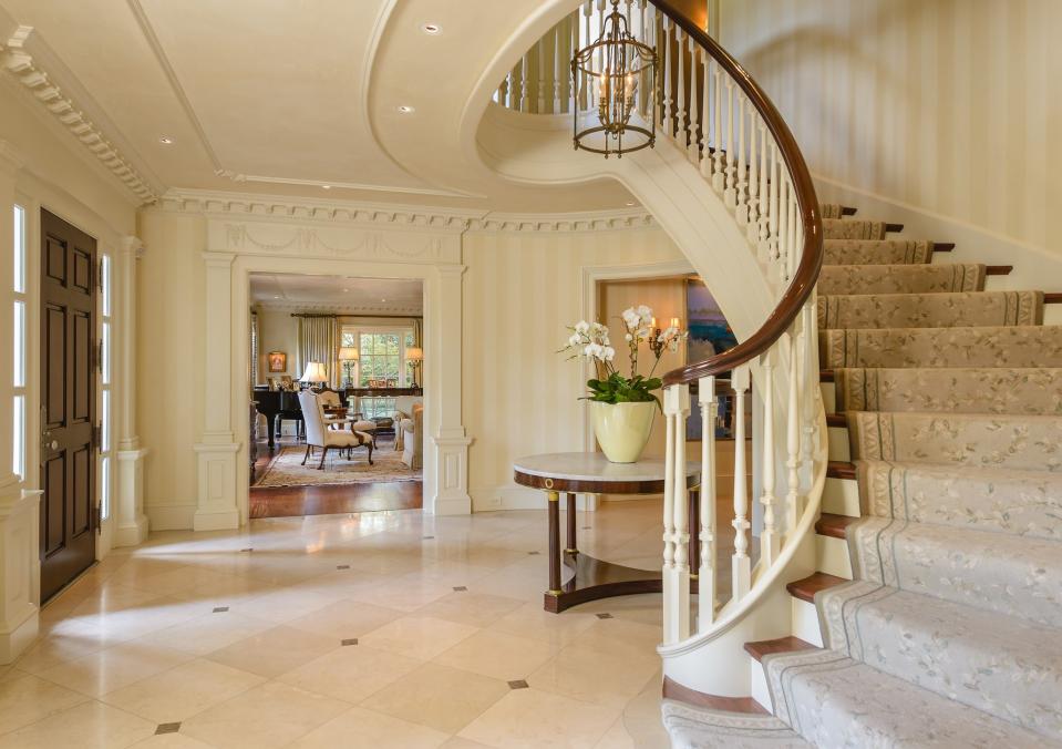 <p>A home of this stature must have a grand staircase. (Allie Beth Allman & Associates) </p>