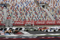 Kurt Busch (1) leads the pack as the green flag is waved at the start of the NASCAR Cup Series auto race at Charlotte Motor Speedway Sunday, May 24, 2020, in Concord, N.C. (AP Photo/Gerry Broome)