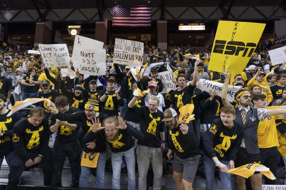 Missouri fans cheer as their team warms up before the start of an NCAA college basketball game against Kansas Saturday, Dec. 10, 2022, in Columbia, Mo. (AP Photo/L.G. Patterson)