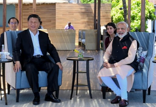 India's Prime Minister Narendra Modi (R) told Chinese President Xi Jinping (L) that their summit would launch a "new era of cooperation" between the world's two largest nations