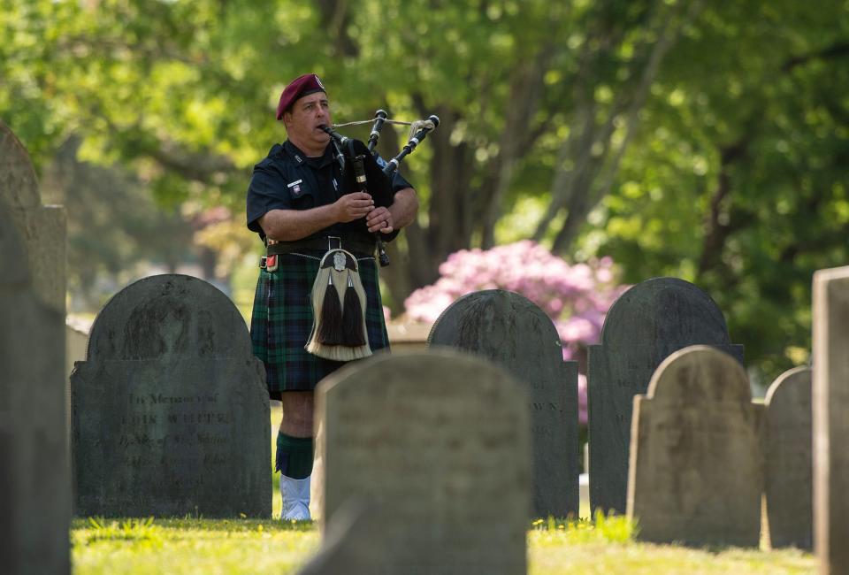 Worcester Police Officer Sean M. Lovely plays "Amazing Grace" to conclude the city’s Memorial Day ceremony in Hope Cemetery Monday.