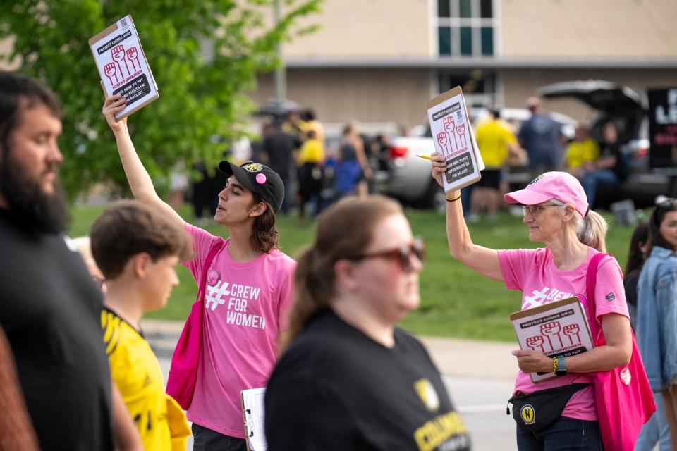 May 13, 2023; Columbus, Ohio, USA; Shanti Miyamoto, left, and Sheryl Murray collect signatures to put a ballot issue about enshrining abortion rights into the state constitution before voters in November 2023.