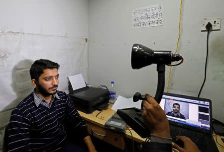 A man goes through the process of eye scanning for the Unique Identification (UID) database system, also known as Aadhaar, at a registration centre in New Delhi, India, January 17, 2018. REUTERS/Saumya Khandelwal