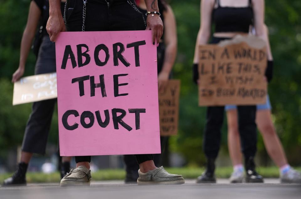 A protester's sign is shown during a central Ohio student-led rally for reproductive rights at the Ohio Statehouse.