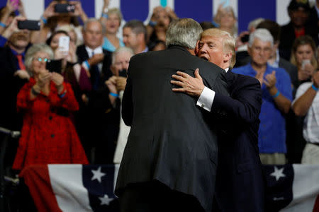 U.S. President Donald Trump embraces Sen. Luther Strange (R-AL) during a campaign rally in Huntsville, Alabama, U.S. September 22, 2017. REUTERS/Aaron P. Bernstein