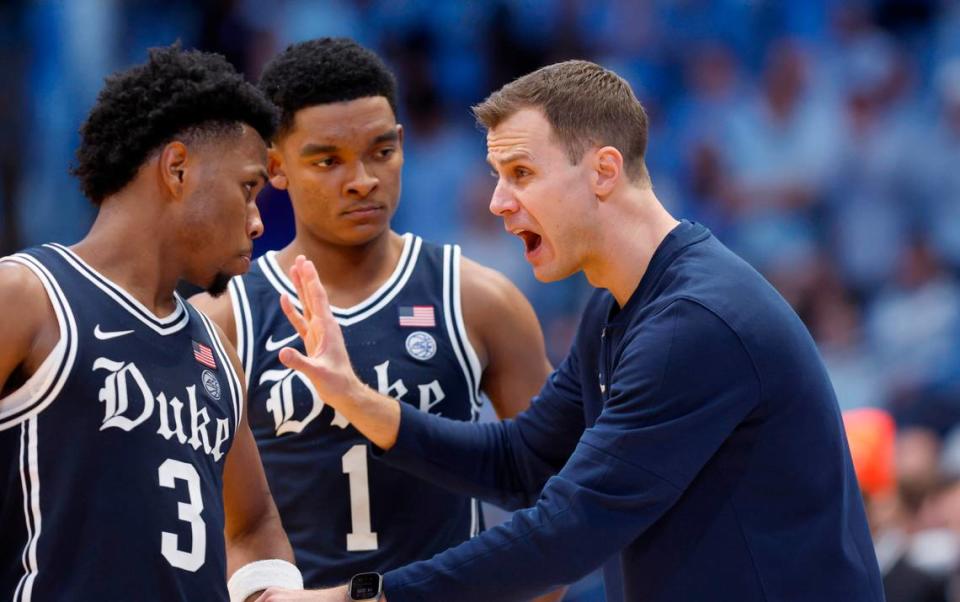 Duke’s head coach Jon Scheyer talks with Jeremy Roach (3) and Caleb Foster (1) during the second half of UNC’s 93-84 victory over Duke at the Smith Center in Chapel Hill, N.C., Saturday, Feb. 3, 2024.