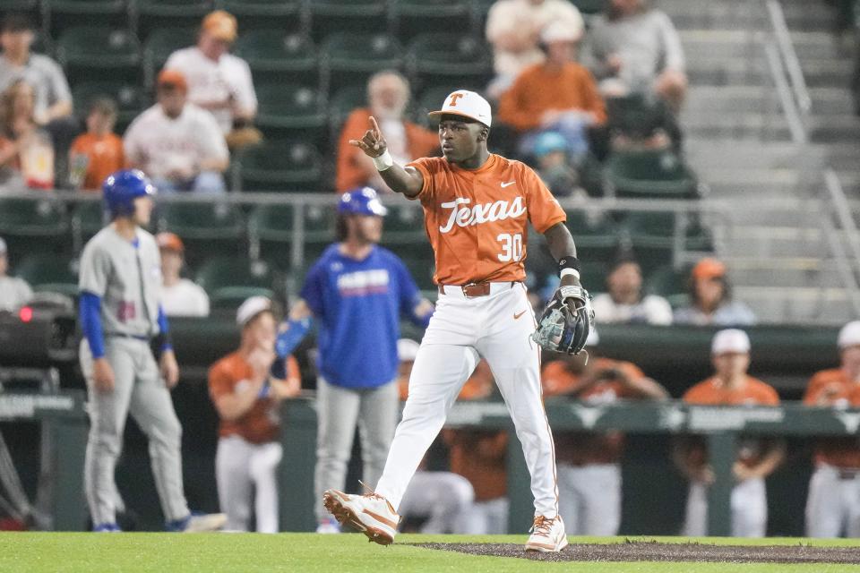 Texas infielder Dee Kennedy throws his Horns up as the Longhorns took on Houston Christian at UFCU Disch–Falk Field last month. Kennedy drove home the decisive run in Texas' 6-5 win over Air Force on Tuesday.