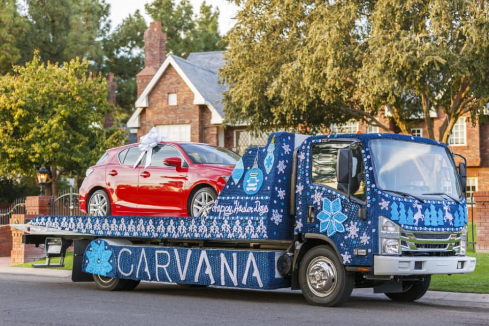 Carvana car being delivered via flatbed