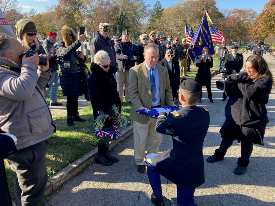 The United States flag is presented to Andrew McVeigh of Oakland, nephew of Lt. John Heffernan.  It was McVeigh’s DNA that helped Army Identify Heffernan’s remains.
