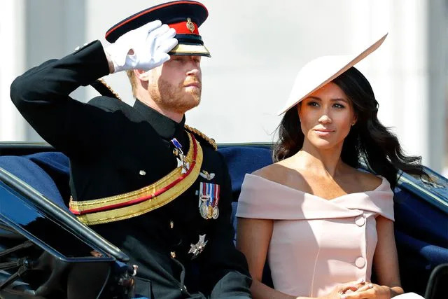 Max Mumby/Indigo/Getty Prince Harry and Meghan Markle attend Trooping the Colour on June 9, 2018