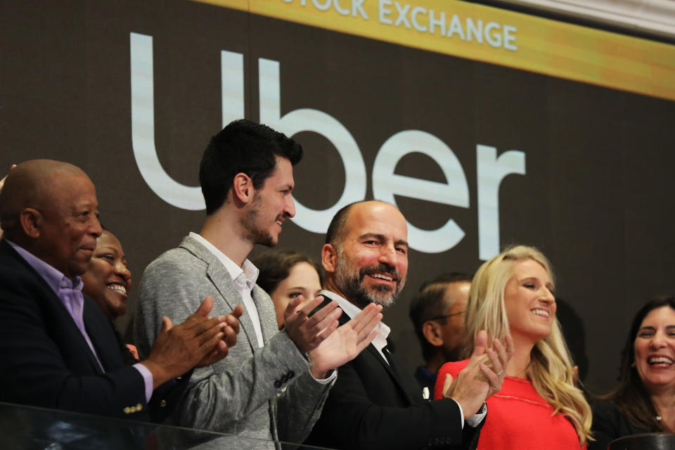 NEW YORK, NEW YORK - MAY 10: Uber CEO Dara Khosrowshahi (center) joins other employees in ringing the Opening Bell at the New York Stock Exchange (NYSE) as the ride-hailing company Uber makes its highly anticipated initial public offering (IPO) on May 10, 2019 in New York City. Uber will start trading on the New York Stock Exchange after raising $8.1 billion in the biggest U.S. IPO in five years.Thousands of Uber and other app based drivers protested around the country on Wednesday to demand better pay and working conditions including sick leave, overtime and a minimum wage. (Photo by Spencer Platt/Getty Images)