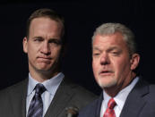 Quarterback Peyton Manning, left, listens as Indianapolis Colts owner Jim Irsay announces that the NFL football team will release quarterback Peyton Manning during a news conference in Indianapolis, Wednesday, March 7, 2012. (AP Photo/Michael Conroy)