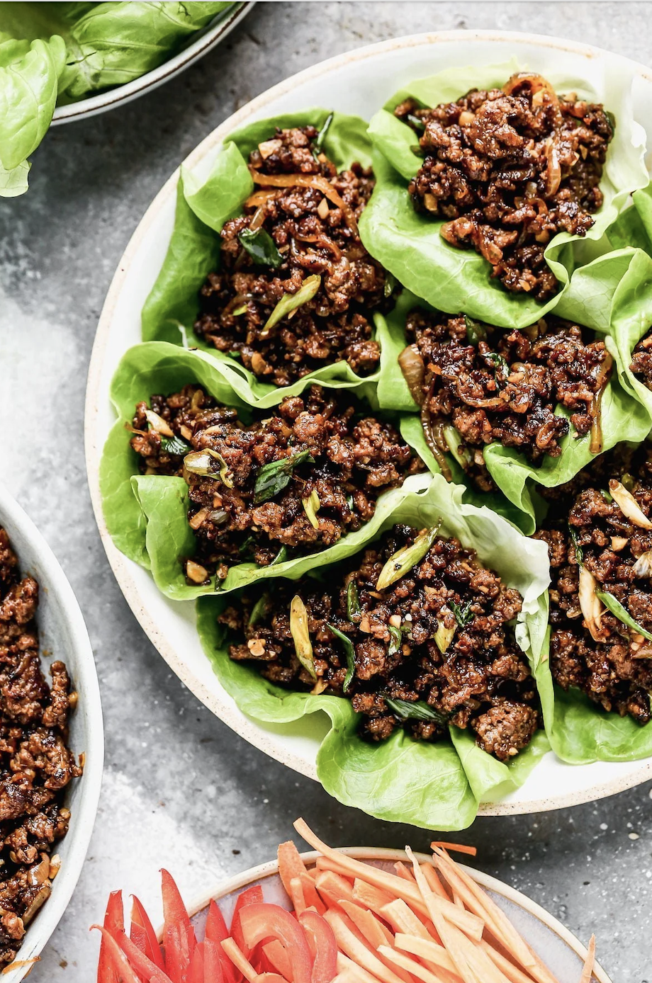 A dish with minced meat and herbs served in lettuce cups