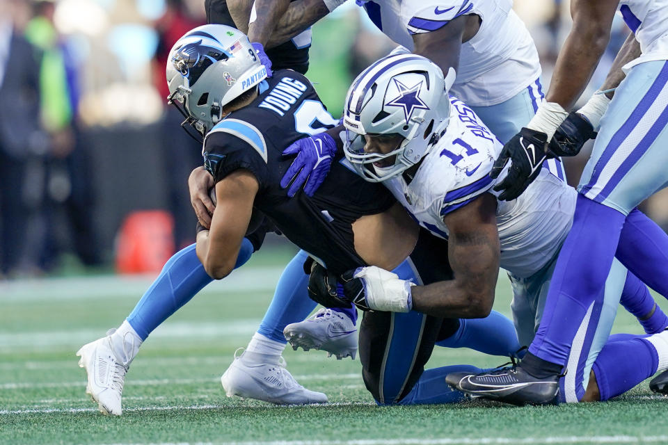 Carolina Panthers quarterback Bryce Young is sacked by Dallas Cowboys linebacker Micah Parsons during the second half of an NFL football game Sunday, Nov. 19, 2023, in Charlotte, N.C. (AP Photo/Erik Verduzco)