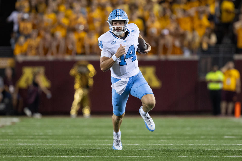 MINNEAPOLIS, MN - AUGUST 29: North Carolina Tar Heels quarterback Max Johnson (14) runs with the ball during the college football game between the North Carolina Tar Heels and the Minnesota Golden Gophers on August 29, 2024, at Huntington Bank Stadium in Minneapolis, MN. (Photo by Bailey Hillesheim/Icon Sportswire via Getty Images)