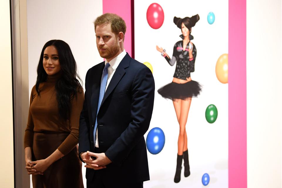 Britain's Prince Harry, Duke of Sussex and Meghan, Duchess of Sussex react as they are show a special exhibition of art by Indigenous Canadian artist, Skawennati, in the Canada Gallery during their visit to Canada House, in London on January 7, 2020, to give thanks for the warm Canadian hospitality and support they received during their recent stay in Canada. (Photo by DANIEL LEAL-OLIVAS / POOL / AFP) (Photo by DANIEL LEAL-OLIVAS/POOL/AFP via Getty Images)