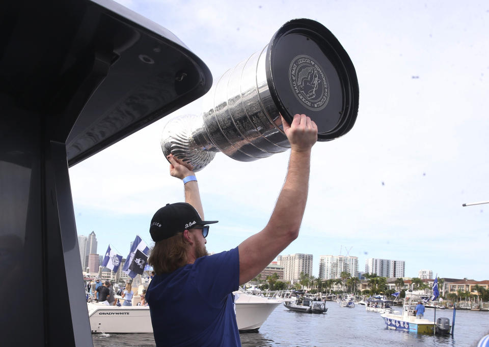 Tampa Bay Lightning's Steven Stamkos holds the Stanley Cup before his boat launches for the NHL hockey Stanley Cup champions' Boat Parade, Wednesday, Sept. 30, 2020 in Tampa, Fla. (Dirk Shadd/Tampa Bay Times via AP)