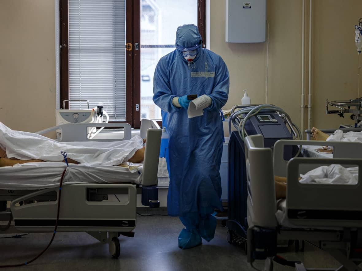 Another 12 COVID-19-related deaths were reported on Friday in Saskatchewan, making it the province's third-deadliest day of the pandemic. (Dimitar Dilkoff/AFP/Getty Images - image credit)