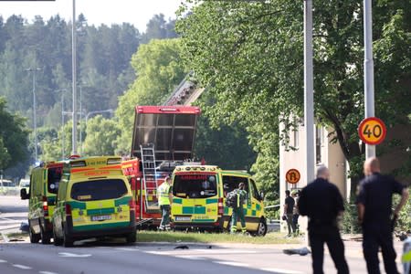 Rescue personnel are seen at the site of an explosion in Linkoping