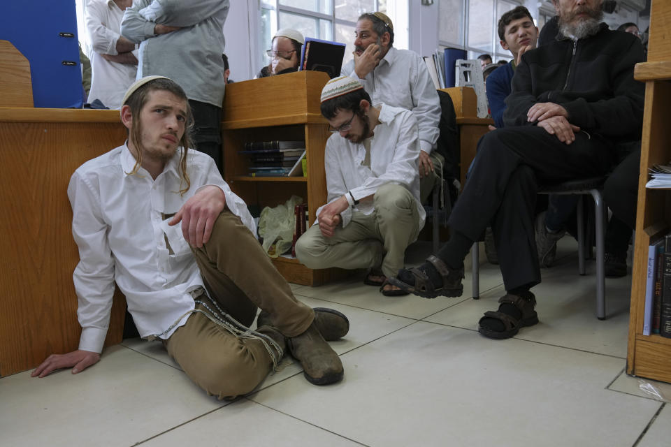 Mourners attend the funeral of rabbi Haim Drukman in Merkaz Shapira, a village in southern Israel, Monday, Dec. 26, 2022. Haim Drukman, a prominent rabbi who was one of the founders of Israel's settlement movement, and a former member of Knesset, Israel's parliament, died Sunday. He was 90. Drukman was a leading figure in the religious Zionist movement in Israel, and a major proponent of Jewish settlements in the West Bank, the Gaza Strip and the Sinai Peninsula after Israel captured those territories in the 1967 Mideast war. (AP Photo/Tsafrir Abayov)