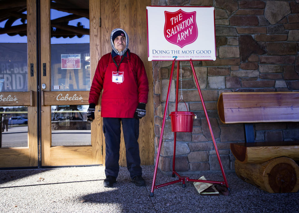 Salvation Army volunteers, like this man in Scarborough, Maine, are ubiquitous during the holiday season. (Photo: Derek Davis/Portland Portland Press Herald via Getty Images)