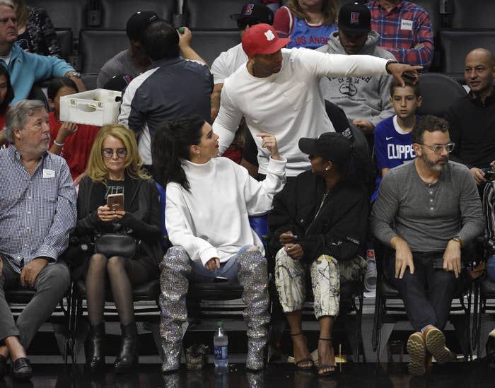 Kendall sitting in the front seat at a sporting event