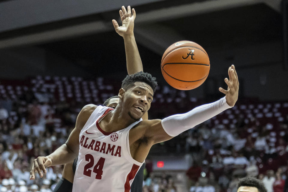 FILE - Alabama forward Brandon Miller (24) reaches for a rebound against Vanderbilt during the first half of an NCAA college basketball game, Tuesday, Jan. 31, 2023, in Tuscaloosa, Ala. Miller is among the top prospects in next month’s NBA draft. (AP Photo/Vasha Hunt, File)