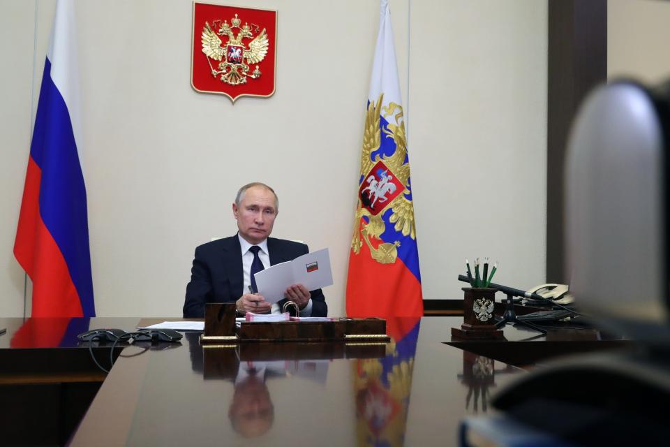 Russian President Vladimir Putin attends a meeting with leaders of the State Duma, the Lower House of the Russian Parliament factions via video conference residence at the Novo-Ogaryovo outside Moscow, Russia, Wednesday, Feb. 17, 2021. (Mikhail Klimentyev, Sputnik, Kremlin Pool Photo via AP)