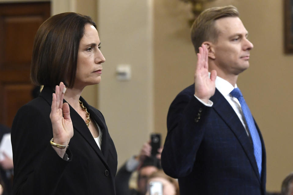 Former White House national security aide Fiona Hill, and David Holmes, a U.S. diplomat in Ukraine, are sworn in to testify before the House Intelligence Committee on Capitol Hill in Washington, Thursday, Nov. 21, 2019, during a public impeachment hearing of President Donald Trump's efforts to tie U.S. aid for Ukraine to investigations of his political opponents.(AP Photo/Susan Walsh)