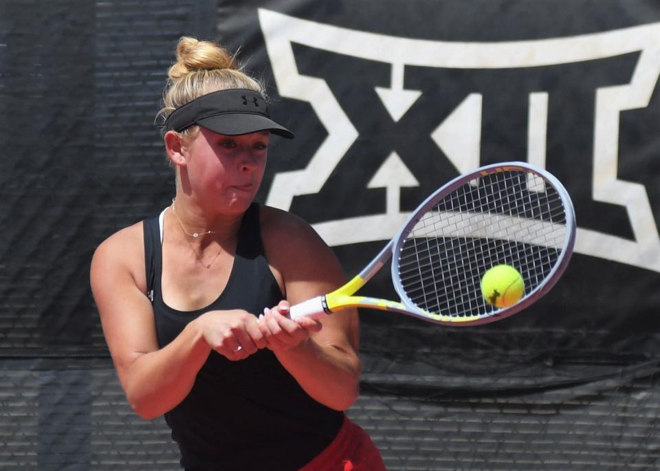 Lubbock-Cooper's Gracie Wood hits the ball in a first-round match at the Region I-5A tennis tournament Monday, April 10, 2023, at Texas Tech's McLeod Tennis Center.