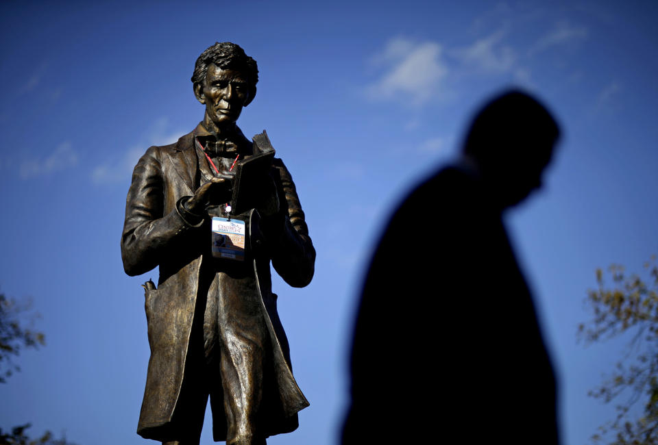 <p>A personalized Abraham Lincoln credential for Thursday’s vice presidential debate hangs on a statue of Lincoln, Oct. 10, 2012, at Centre College in Danville, Ky. (AP Photo/David Goldman) </p>