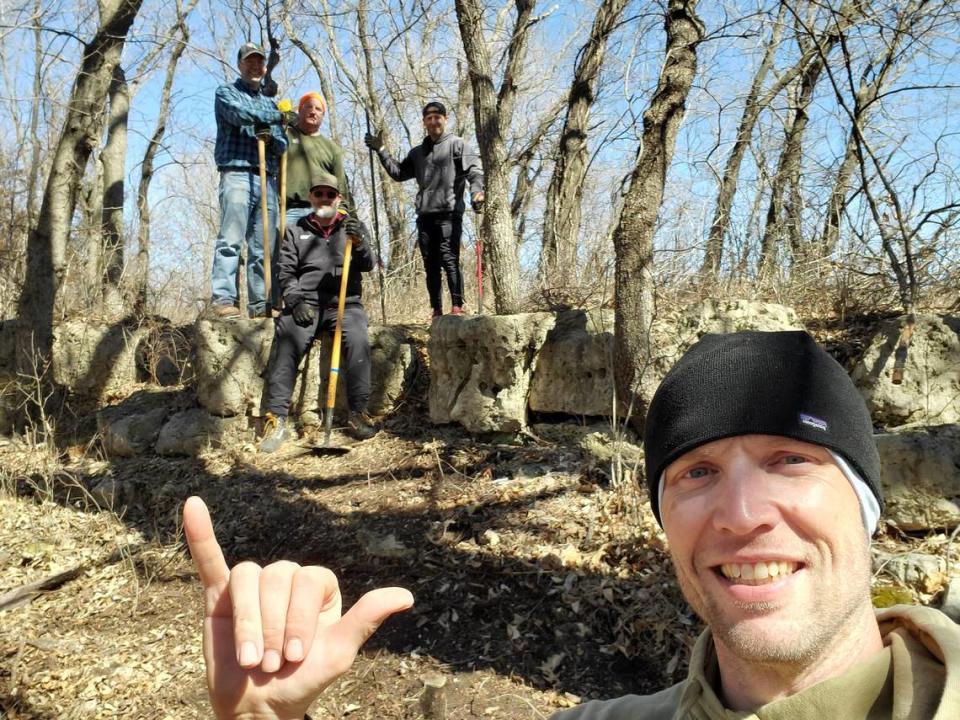 Bicycle Pedaler owner Tyler Branine, with a group of volunteers in March 2023 as they worked on a mountain bike trail at El Dorado State Park. More than 50 volunteers put in more than 1,000 hours of work on the first 5.5 miles of intermediate trails.