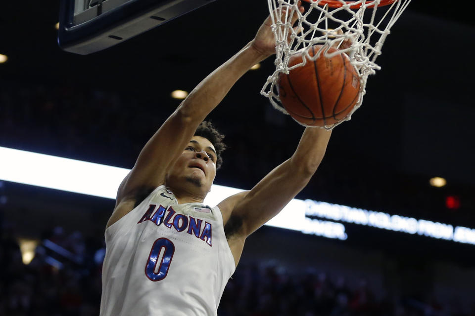 FILE - In this Wednesday, Dec. 11, 2019 file photo, Arizona guard Josh Green (0) dunks against Omaha in the second half during an NCAA college basketball game in Tucson, Ariz. The Dallas Mavericks drafted Arizona guard Josh Green with the 18th pick in the first round Wednesday night, Nov. 18, 2020 adding a backcourt mate for Luka Doncic (AP Photo/Rick Scuteri, File)