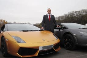 Undated handout photo issued by the Metropolitan police of Detective Superintendent Nick Downing with two vehicles that were seized as part of police investigations into insurance scams and money laundering through an international hire car ruse. PRESS ASSOCIATION Photo. Issue date: Tuesday December 3, 2013. Detectives in London carried out dawn raids after investigators said rental bosses were supplying criminals with incorrectly-insured cars to help them evade detection. The Met Police's central criminal finances team gathered intelligence on a number of organised crime groups believed to be using the proceeds of crime to buy cars which they hired out to other criminals.See PA story POLICE Cars. Photo credit should read: Metropolitan Police/PA WireNOTE TO EDITORS: This handout photo may only be used in for editorial reporting purposes for the contemporaneous illustration of events, things or the people in the image or facts mentioned in the caption. Reuse of the picture may require further permission from the copyright holder.